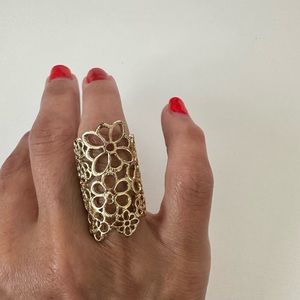 Large floral gold tone ring.